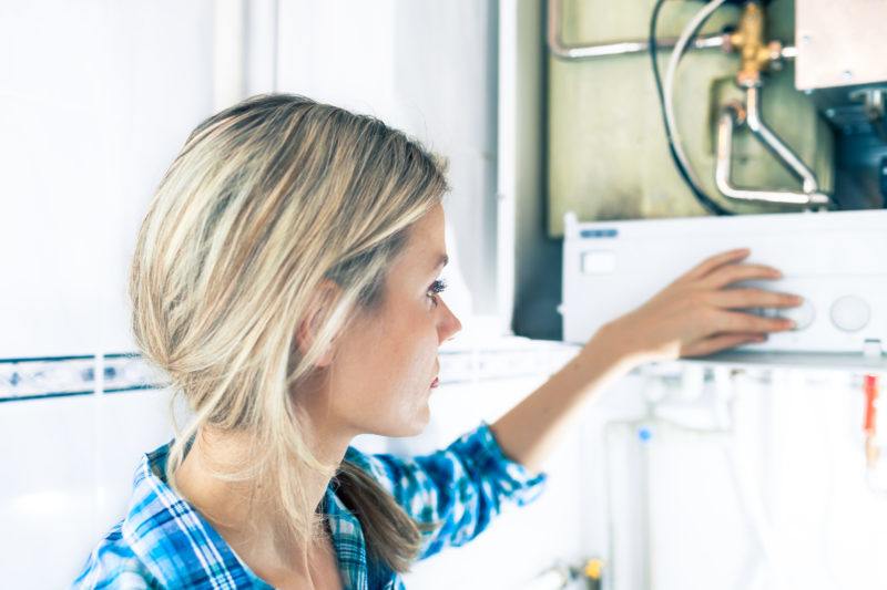 woman at water heater